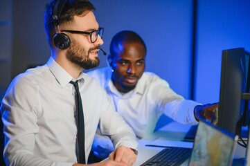 Happy Confident Technical Customer Support Specialist Having a Headset Call in a Monitoring and...