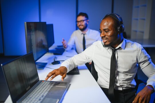 Young male technical support dispatchers in call center