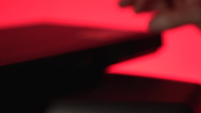 Man inserting disk into DVD player