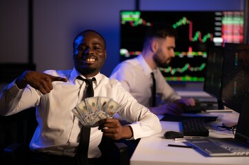 Holding Dollar bills in the stock market. Investor counting money after making it big on the stock market