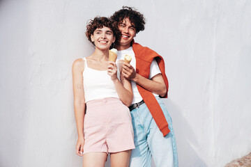 Smiling beautiful woman and her handsome boyfriend. Woman in casual summer clothes. Happy cheerful...