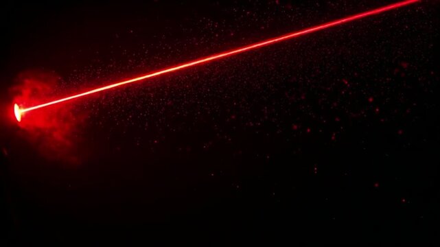 Powerful red laser beam with smoke effect on a black background