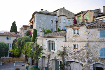 Historic stone buildings with greenery in Provence village
