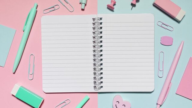 Stop motion notebook opens on a pink and blue split set with matching stationery