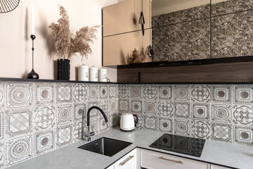 Close-Up of Stylish Kitchen Counter with Patterned Tiles