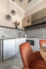Modern Kitchen Interior with Beige Walls and Decorative Tiles