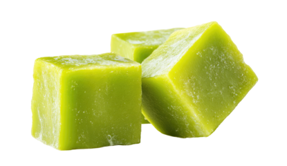 Close-up of three vibrant green, square ice cubes