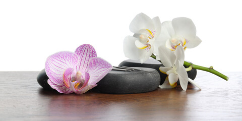 Acupuncture needles, orchid flowers and spa stones on wooden table against white background