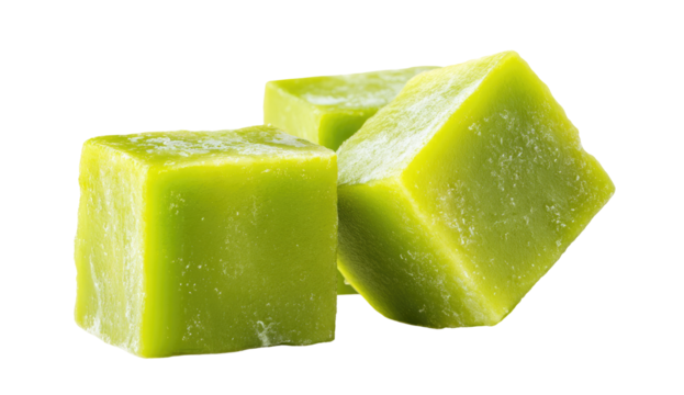 Close-up of three vibrant green, square ice cubes