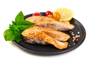 Grilled Salmon Fillets with Basil, Lemon and Tomatoes, isolated on white background.