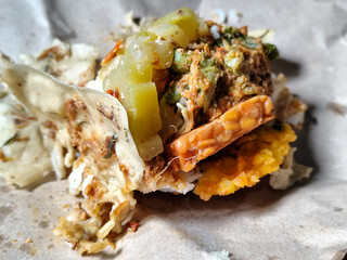Nasi pecel or sego pecel is a typical Javanese Indonesian rice dish served with pecel sauce, which...