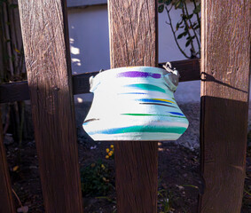 Ceramic pots on a wooden fence