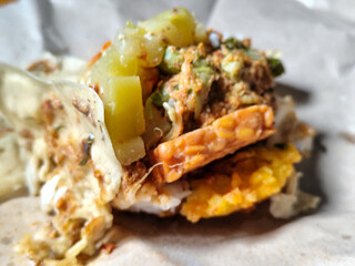 Nasi pecel or sego pecel is a typical Javanese Indonesian rice dish served with pecel sauce, which...