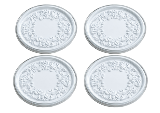 Four decorative, circular, white, plaster-like ceiling medallions, embossed with ornate floral patterns