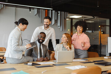 Business team in modern office collaborating during meeting