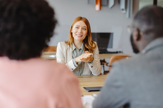 Businesswoman in office interview meeting with professionals
