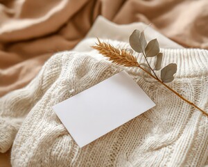 Blank Card On Knitted Beige Sweater With Dried Flowers