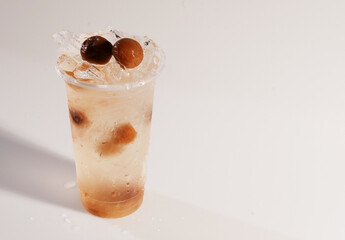 Iced preserved plum drink with whole plums
