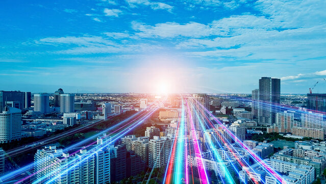 Urban landscape and a band of light stretching into the future