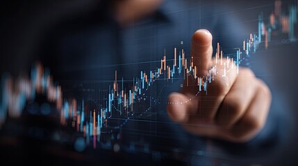 A person's finger touches a digital chart showing a rising trend