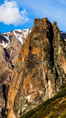 Rocky mountain peak, dramatic cliffs