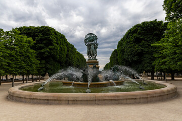 Fototapeta premium Paris, historical architecture of the city. Fountain on the city square. Paris France.