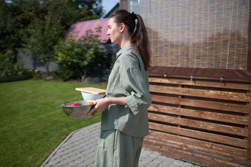 Woman cooking in her backyard