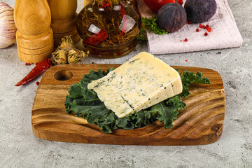 Blue cheese piece over board