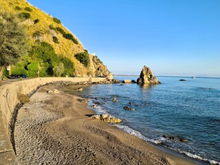 evocative image of an italian beach at sunset