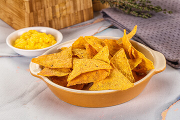 Corn nachos chips with cheese dip
