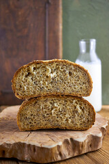 Rustic artisan bread photography series showing stacked loaves, sliced bread with milk, and country-style food compositions on wooden backgrounds, highlighting organic bakery and farmhouse lifestyle