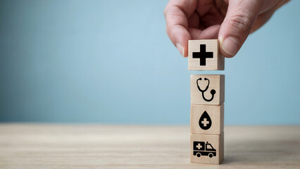 Healthcare symbols on wooden blocks represent medical services and support