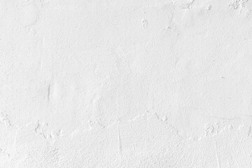 White concrete wall texture background. Uneven render stucco white painted concrete wall texture background. Rough and grunge wall in the sun.