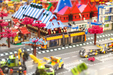 Obraz premium Colorful lego city scene with train and buildings
