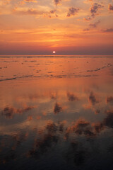 setting sun and cloud reflections