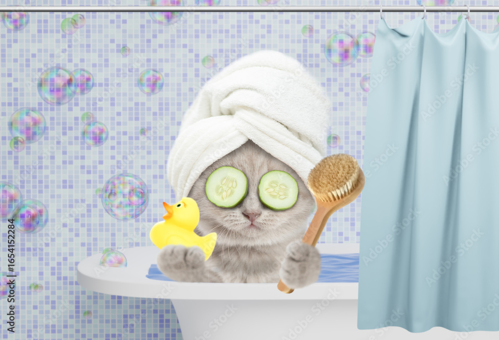 Poster cute kitten with towel on it head and slices of cucumber on it eyes takes the bath at home with rubb
