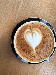 Flat White Coffee with Heart Latte Art Closeup. Barista Latte Art Skill.	