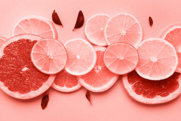 Different citrus slices and leaves on turquoise background