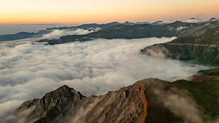 Sunrise illuminating clouds over Kocduzu Highland in Rize, Turkiye