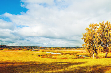 Autumn sunny landscape with colorful view of the Soroti river valley in Pushkinskiye Gory, Russia -...