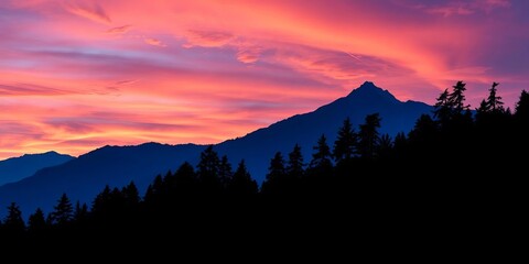 Naklejka premium Serene blue silhouette of mountain range with dark forest tree silhouettes against a vibrant sky, contrast, scenic