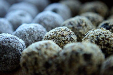 Vegan energy date nut raisin cocoa balls in a close arrangement