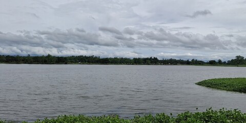 Scenic lake reflection serene landscape photography calm waters wide-angle view nature's beauty...