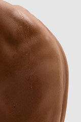 Fototapeta premium Close up of human shoulder with water drops after wellness treatment. Concept of bodycare, hydration, wellness routines, dermatology, and aesthetic medicine practices.