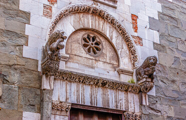 The entrance portal of Sant'Andrea Church with sculptures of lions, Lucca, Italy
