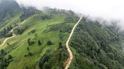 Fog Rolling over Green Hills and Dirt Road in the Black Sea Region of Turkiye