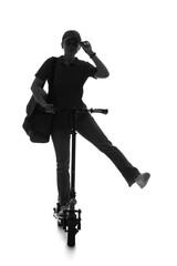 Naklejka premium Silhouette of female courier riding electric scooter on white background
