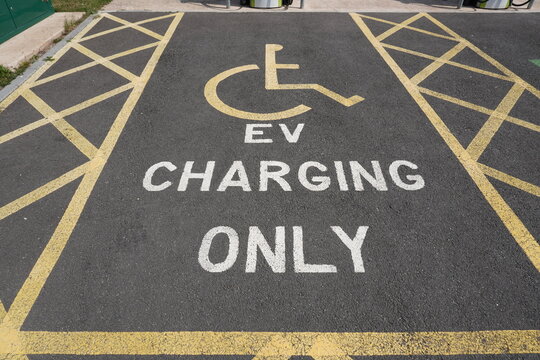 Rushcliffe Country Park, Nottinghamshire, England &ndash; August 13 2025: Electric vehicle charging bay designated for disabled drivers in Nottinghamshire's scenic country park.