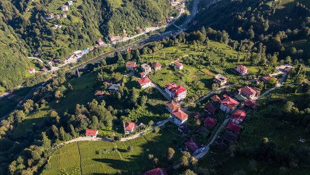 Camlihemin village nestled on lush green hillside in Rize, Turkiye, offering breathtaking aerial view