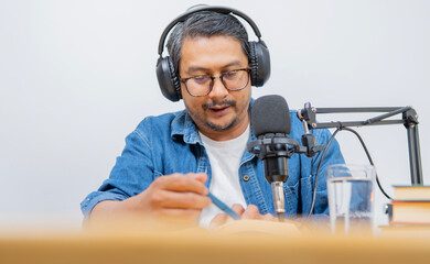 Man and podcast with mic, talking and home studio with smile for live streaming